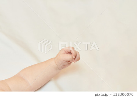 Close-Up Of Caucasian Baby Hand On Soft Fabric In Gentle Light Setting Close-Up Of Caucasian Baby Hand On Soft Fabric In Gentle Light Setting 138300070