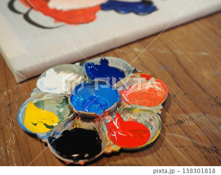 Paint palette acrylic paint artistic tool colorful pigment wooden table creative hobby closeup detail painting process art canvas studio light Palette of colorful acrylic paint wooden table near 138301818