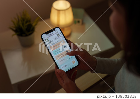 Smartphone controlling smart home lighting system Smartphone controlling smart home lighting system 138302818