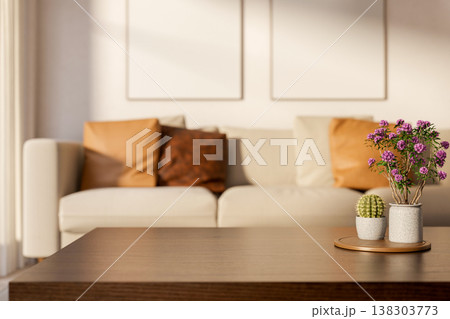 Cactus and potted plant on tray at wooden table with sofa couch and sunlight shining in living room. Cactus and potted plant on tray at wooden table with sofa couch and sunlight shining in living room. 138303773