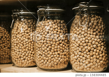 Glass Jars Filled with Chickpeas on Shelf 138304485