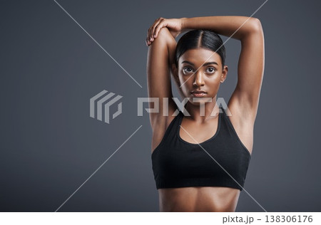 Thinking, fitness and stretching with an athlete woman in studio on a gray background for health on mockup. Exercise, idea and warm up with an attractive young female model training her body Thinking, fitness and stretching with an athlete woman in studio on a gray background for health on mockup. Exercise, idea and warm up with an attractive young female model training her body 138306176