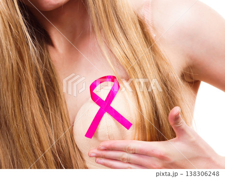 Woman chest in bra, pink cancer ribbon 138306248