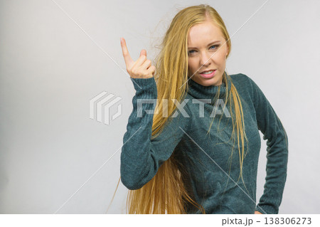 Woman pointing finger displeased 138306273