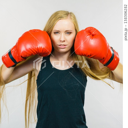 Woman in gloves playing sports boxing 138306282