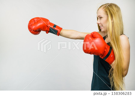 Woman in red gloves boxing Woman in red gloves boxing 138306283