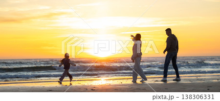 Family enjoying beach walk during sunset vacation Family enjoying beach walk during sunset vacation 138306331