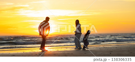 Family walking beach together during golden sunset Family walking beach together during golden sunset 138306335