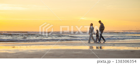 Family walking along beach at golden hour sunset Family walking along beach at golden hour sunset 138306354