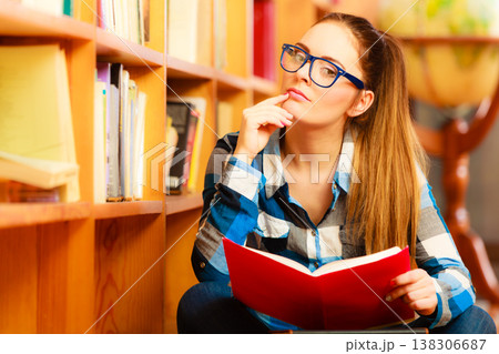 Woman student in college library 138306687