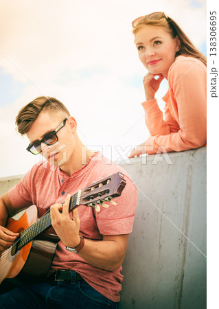 Happy couple with guitar outdoor Happy couple with guitar outdoor 138306695