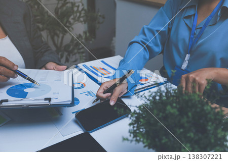 Auditor and accountant team working in office, analyze financial data and accounting record with calculator. Accounting company provide finance and taxation planning for profitable cash flow. 138307221