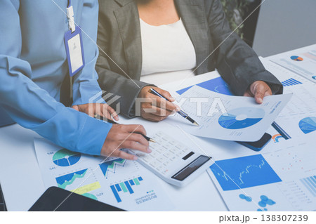 Auditor and accountant team working in office, analyze financial data and accounting record with calculator. Accounting company provide finance and taxation planning for profitable cash flow. Auditor and accountant team working in office, analyze financial data and accounting record with calculator. Accounting company provide finance and taxation planning for profitable cash flow. 138307239
