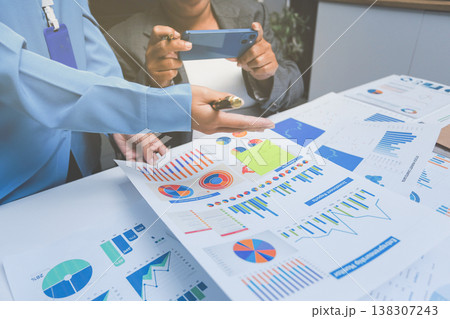 Auditor and accountant team working in office, analyze financial data and accounting record with calculator. Accounting company provide finance and taxation planning for profitable cash flow. Auditor and accountant team working in office, analyze financial data and accounting record with calculator. Accounting company provide finance and taxation planning for profitable cash flow. 138307243