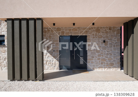 Modular modern smart automated house entrance with stone facade and minimalist covered porch in progress Modular modern smart automated house entrance with stone facade and minimalist covered porch in progress 138309628
