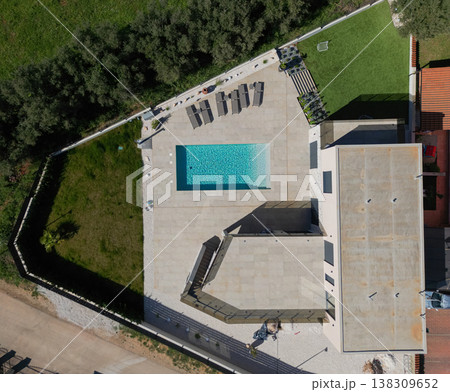 Aerial view of modular modern smart automated house with pool, terrace and unfinished work in progress Aerial view of modular modern smart automated house with pool, terrace and unfinished work in progress 138309652