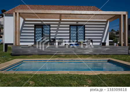 Modern minimalistic house with pergola, swimming pool and modular solar-ready high-efficiency heating and cooling 138309818