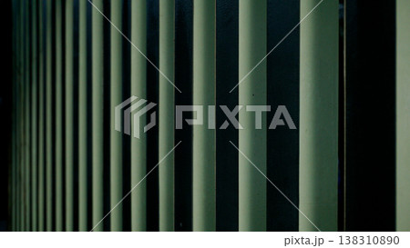 Close up of a green metal blinds on a building wall for design background. 138310890