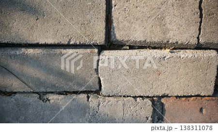 Background of brick wall texture. Abstract geometric pattern texture, Classic outdoor building granite blocks wall. Background of brick wall texture. Abstract geometric pattern texture, Classic outdoor building granite blocks wall. 138311078
