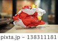 Crumpled red paper on table in coffee shop blur background with bokeh. 138311181