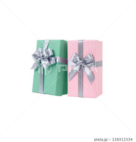 A pink gift box tied with a silk ribbon is placed on a white background. 138311534