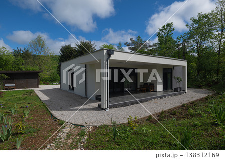 Modular modern minimalist single story house with covered terrace and low energy solar design in garden Modular modern minimalist single story house with covered terrace and low energy solar design in garden 138312169