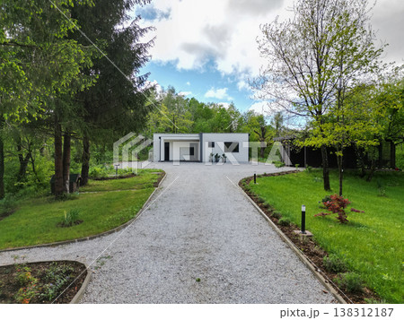 Modular modern minimalist house surrounded by green landscape with low energy and solar features Modular modern minimalist house surrounded by green landscape with low energy and solar features 138312187