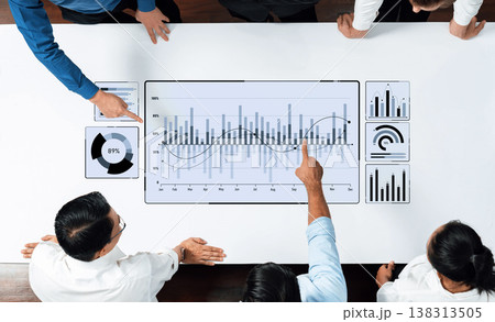 Team Collaboration Analyzing Business Data Insights on Digital Dashboard with Graphs, Charts, and Performance Indicators in Modern Office Setting Trope Team Collaboration Analyzing Business Data Insights on Digital Dashboard with Graphs, Charts, and Performance Indicators in Modern Office Setting Trope 138313505