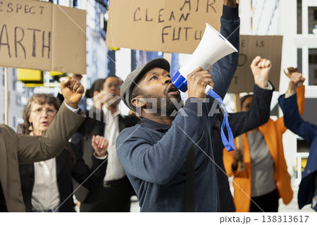 Multiethnic protesters and demonstrators gather in environmental rally, showing unity and community while protesting global crisis and warming. Signs focused on clean environment. Multiethnic protesters and demonstrators gather in environmental rally, showing unity and community while protesting global crisis and warming. Signs focused on clean environment. 138313617