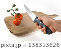 Preparing to Slice Fresh Tomatoes on a Cutting Board 138313626