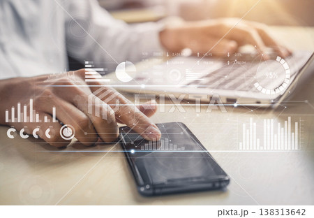 Business professional using smartphone and laptop with digital data analytics interface for productivity and technology in modern workplace setting Scalp Business professional using smartphone and laptop with digital data analytics interface for productivity and technology in modern workplace setting Scalp 138313642
