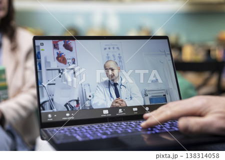Senior people, virtual medical call, physician expert, discussing treatment, laptop camera. Telemedicine checkup, remote diagnosis, dosage clarification, safe elderly care, video conference. Senior people, virtual medical call, physician expert, discussing treatment, laptop camera. Telemedicine checkup, remote diagnosis, dosage clarification, safe elderly care, video conference. 138314058