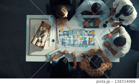 Top view of project manager or engineer writing at blueprint. Alimentation. 138314066