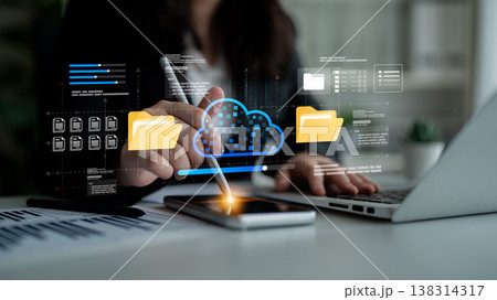 Business Professional Using Digital Tablet to Access Cloud Data Storage and Manage Files in Modern Office Environment with Data Visualization Ledger Business Professional Using Digital Tablet to Access Cloud Data Storage and Manage Files in Modern Office Environment with Data Visualization Ledger 138314317