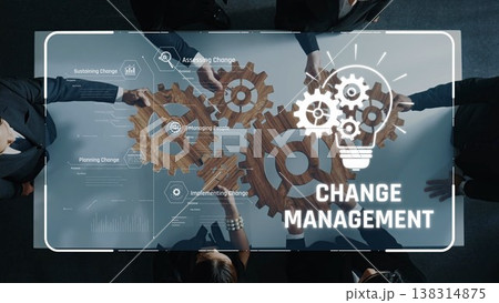 Collaborative Hands Overlaid on Technology Interface for Change Management with Gears and Light Bulb Icons Illustrating Innovation and Adaptability. Raster Collaborative Hands Overlaid on Technology Interface for Change Management with Gears and Light Bulb Icons Illustrating Innovation and Adaptability. Raster 138314875