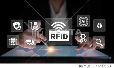 Hands Interacting with Touchscreen Display Featuring RFID Technology and Various Icons Depicting Logistics, Artificial Intelligence, and Inventory Management Systems Ledger Hands Interacting with Touchscreen Display Featuring RFID Technology and Various Icons Depicting Logistics, Artificial Intelligence, and Inventory Management Systems Ledger 138315093