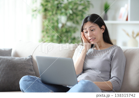 Stressed asian woman messed up after online mistake Stressed asian woman messed up after online mistake 138315742