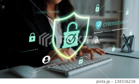 Professional woman typing on keyboard with digital locks and cybersecurity icons representing data protection and security measures in modern office environment Gluon Professional woman typing on keyboard with digital locks and cybersecurity icons representing data protection and security measures in modern office environment Gluon 138316216