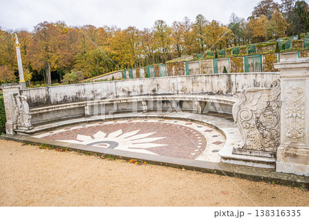White marble Bench in the autumn park Sanssouci Palace Potsdam, Germany. Nature empty garden yellow trees. Landscape Fall outdoor White marble Bench in the autumn park Sanssouci Palace Potsdam, Germany. Nature empty garden yellow trees. Landscape Fall outdoor 138316335