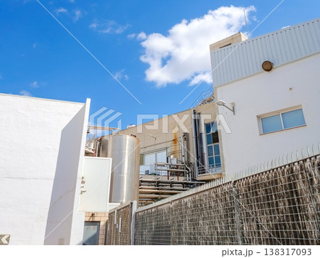 Food Processing Factory Exterior with Storage Tanks and Pipes 138317093