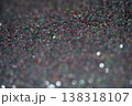 Close-up of colorful glitter particles creating a shimmering background texture for design projects 138318107