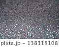 Close-up of shimmering glitter surface with colorful reflections and sparkling texture 138318108