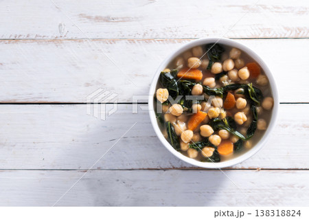 Chickpea and Spinach Soup with Carrots in White Bowl Chickpea and Spinach Soup with Carrots in White Bowl 138318824