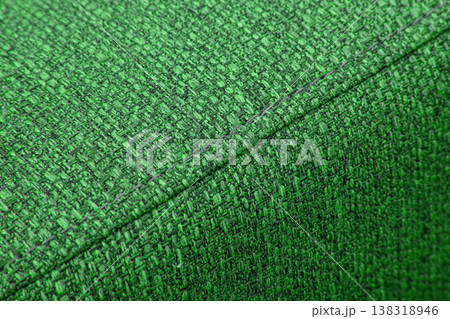 Textured green furniture fabric with stitching 138318946