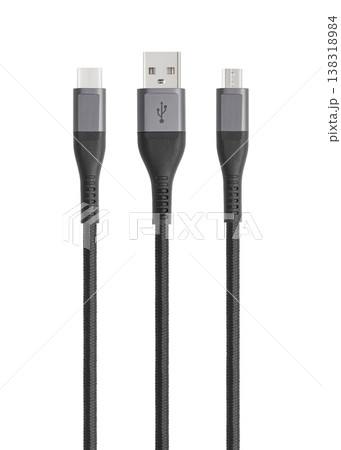 Black cable for charging and synchronization with Type - C, USB, Micro USB, Lightning connectors on a white background 138318984