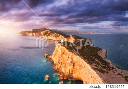 Lighthouse on the mountain peak at colorful sunset in summer 138319665