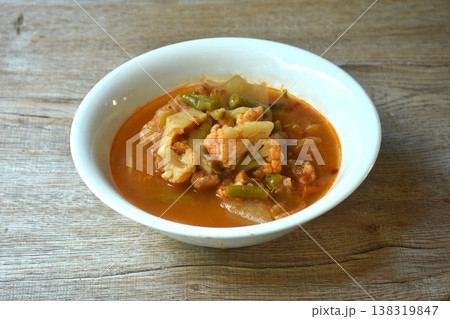boiled mixed vegetable in spicy and sour orange curry soup on bowl boiled mixed vegetable in spicy and sour orange curry soup on bowl 138319847