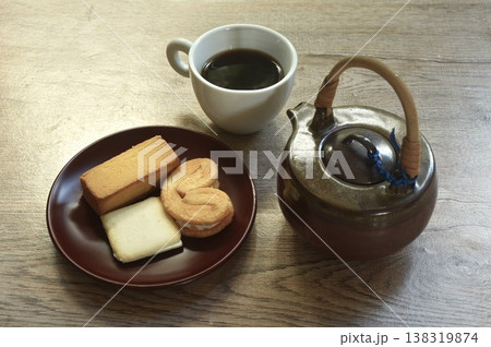 assorted sweet dessert pineapple pie and butterfly pie with black coffee cup on table assorted sweet dessert pineapple pie and butterfly pie with black coffee cup on table 138319874