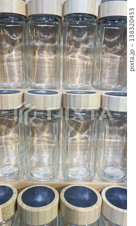 Minimalist glass spice jars with bamboo lids and chalkboard tops for organized eco friendly kitchen Minimalist glass spice jars with bamboo lids and chalkboard tops for organized eco friendly kitchen 138320453