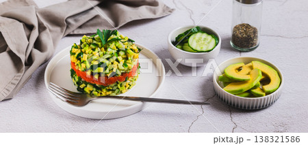Diet salad with avocado, cucumber and red fish on a plate on the table web banner Diet salad with avocado, cucumber and red fish on a plate on the table web banner 138321586